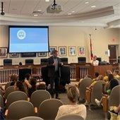Town Manager Kirk Blouin talking to the kids 